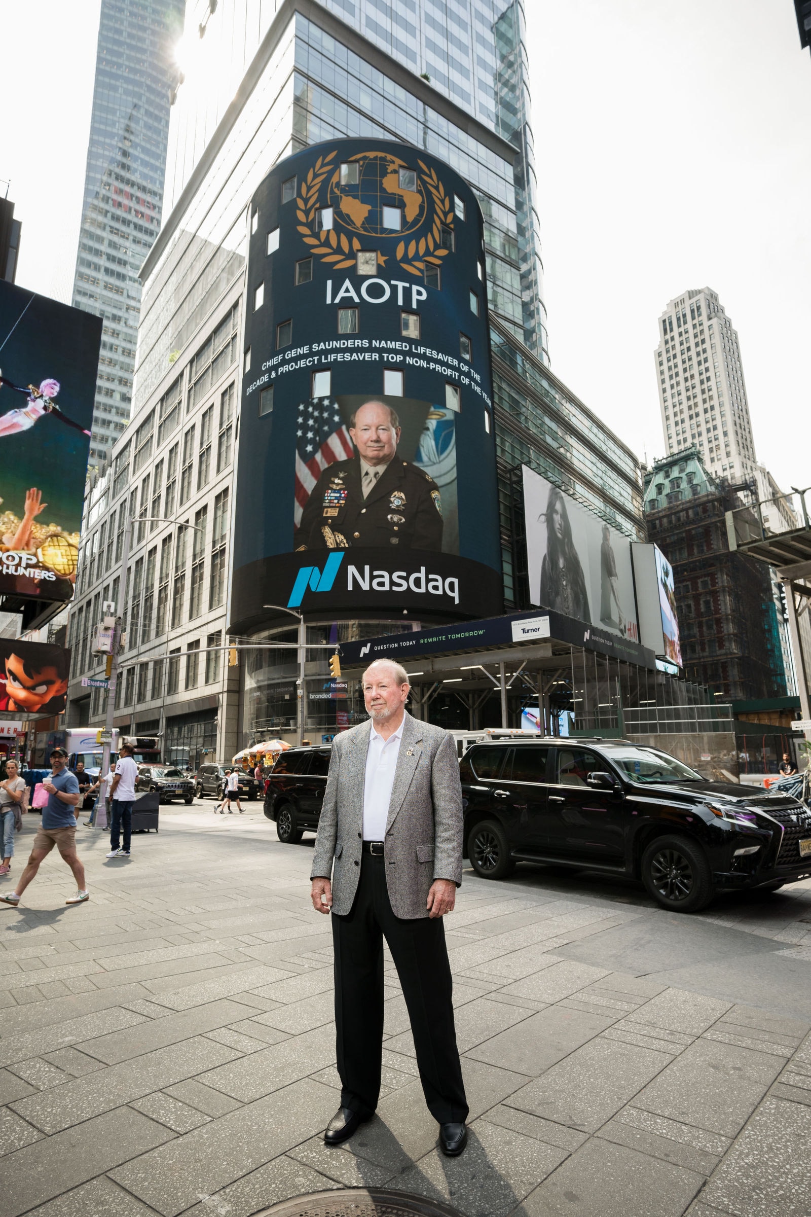 Chief Gene Saunders at the Nasdaq Times Square IAOTP billboard