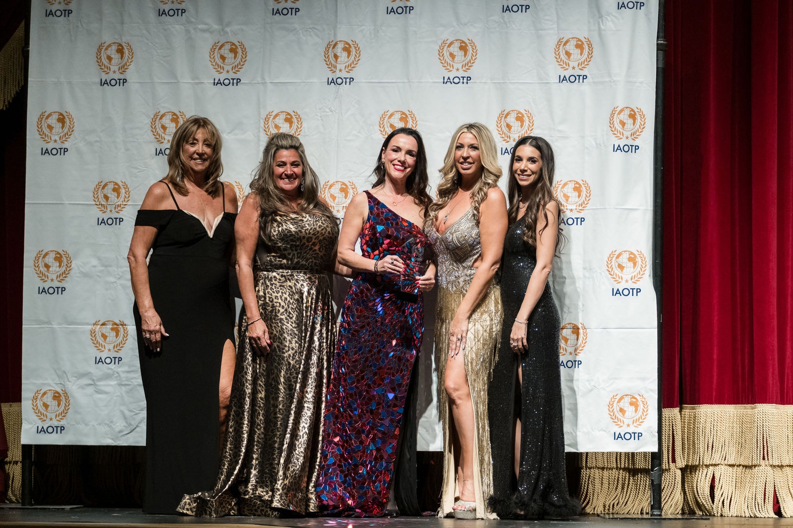 Honorees on stage at an IAOTP Awards Gala
